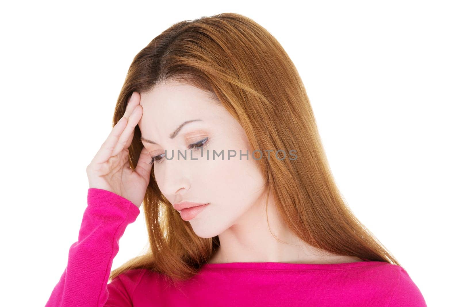 Woman with headache or problem holding her hand to the head