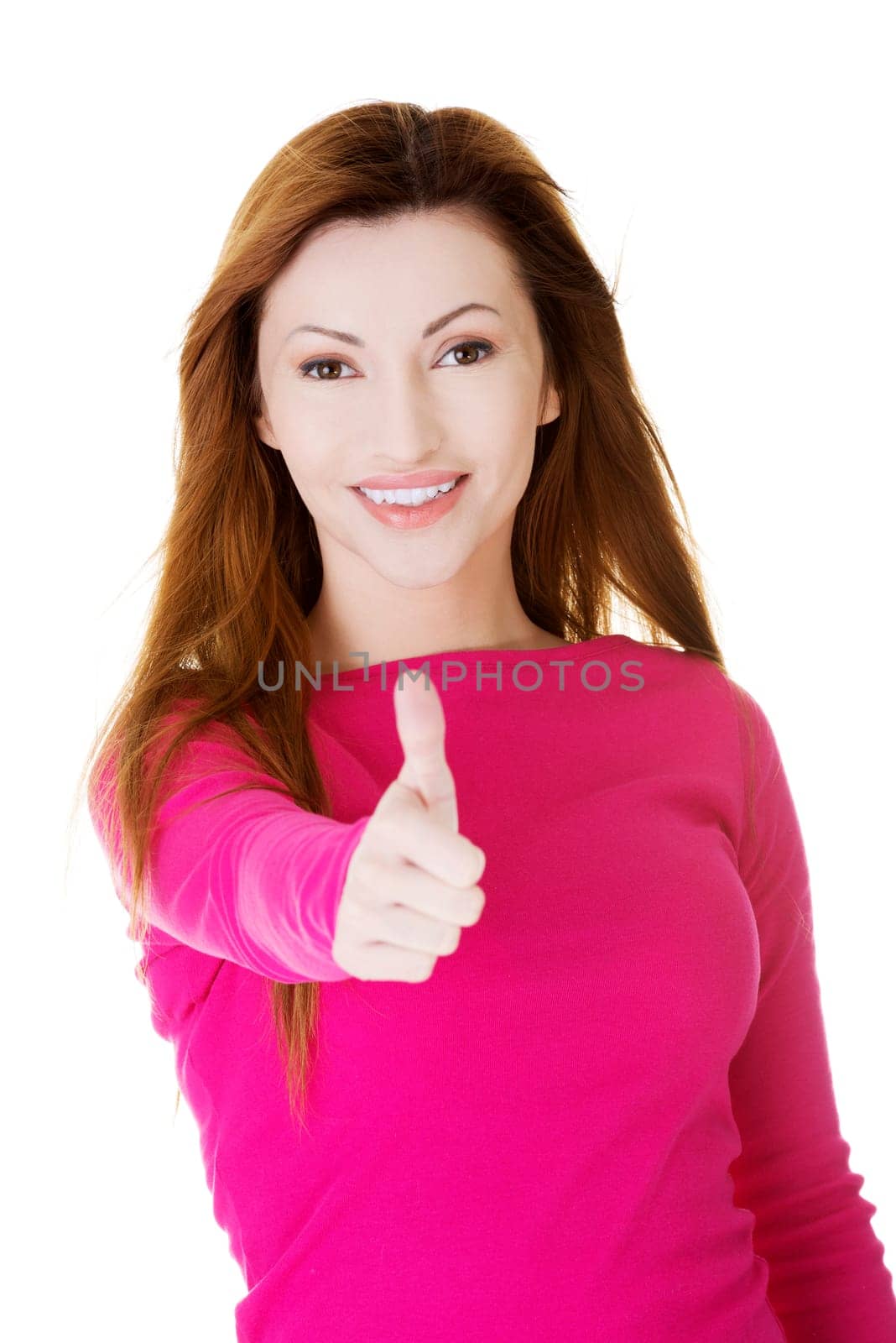 Beautiful woman in casual clothes gesturing thumbs up.
