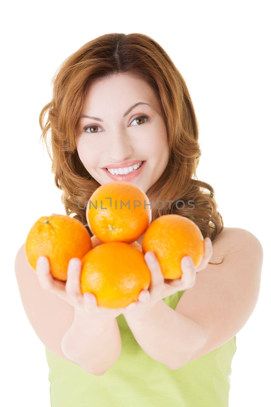 Happy woman with orange fruits, isolated on white