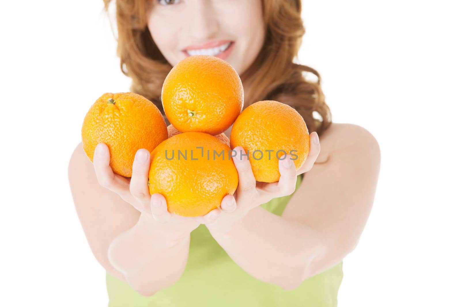 Happy woman with orange fruits, isolated on white