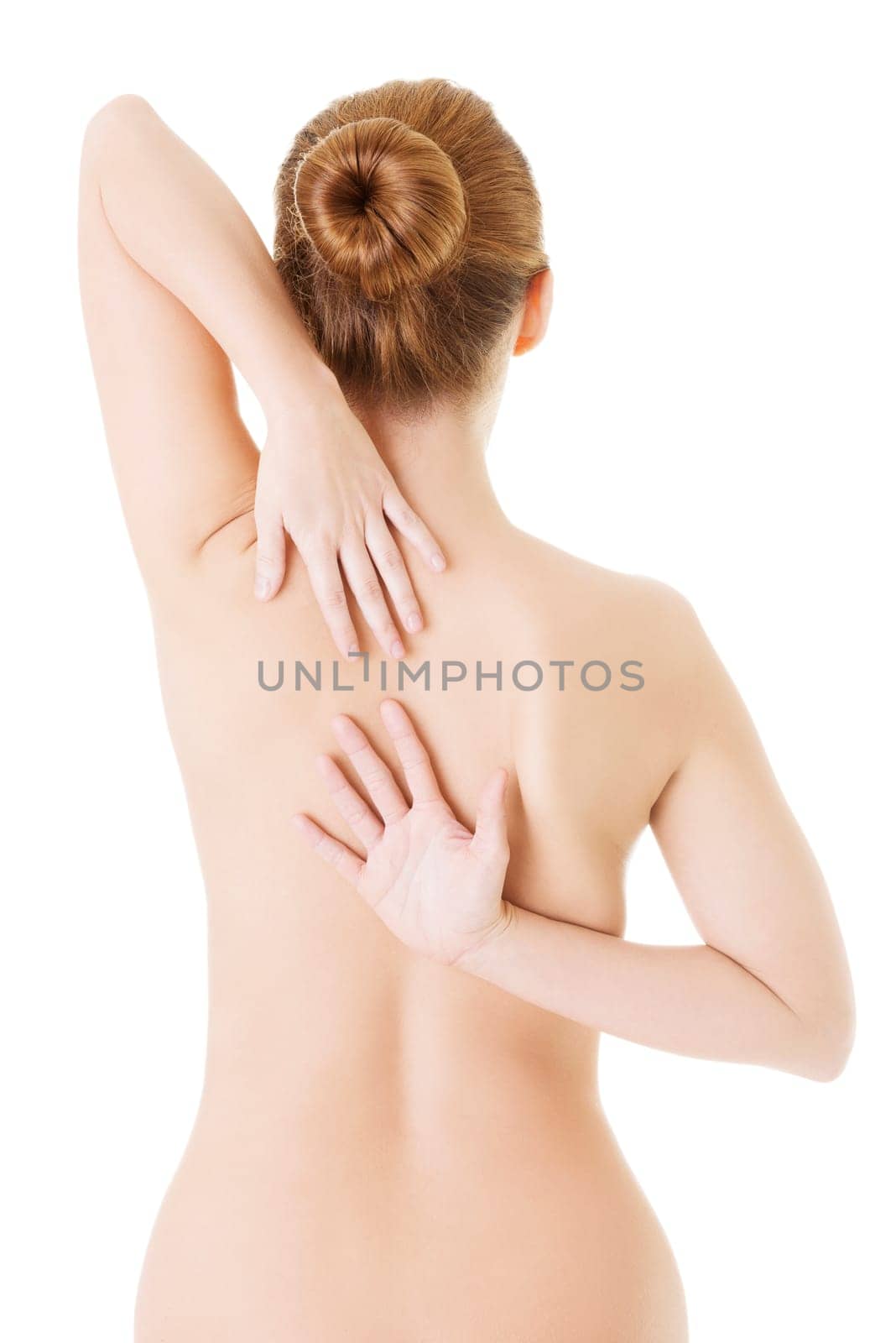 Woman with pain in her back. Isolated on white