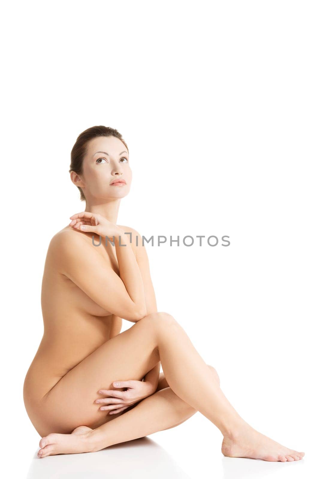 Sexy fit naked woman with healthy clean skin, isolated on white background