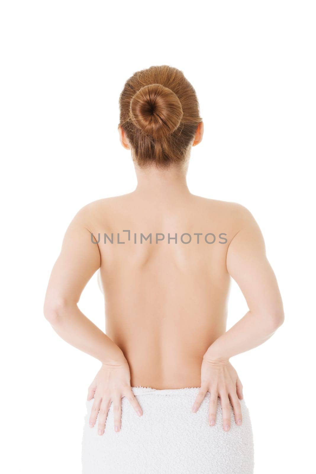 Woman with pain in her back. Isolated on white