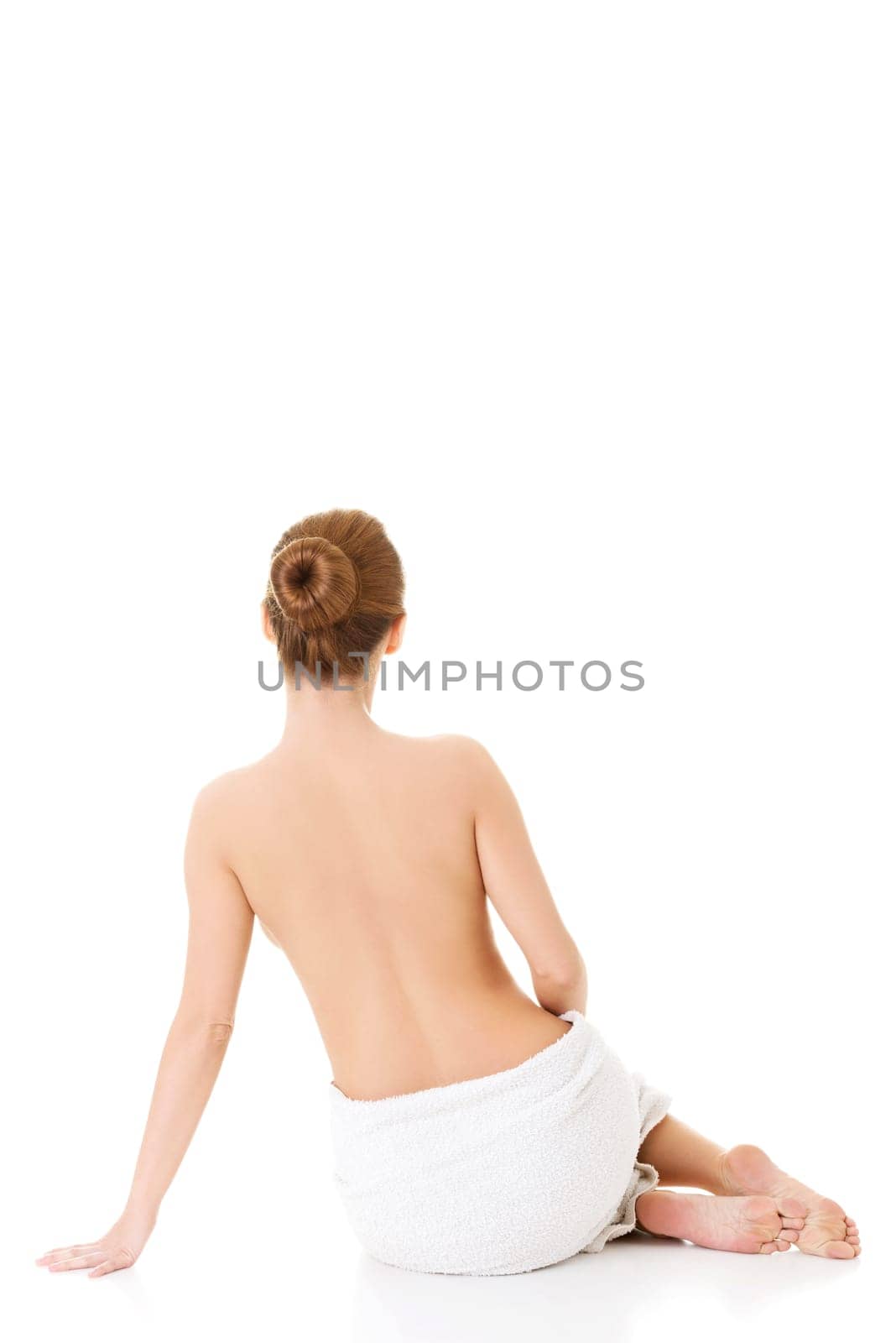 Beautiful nude woman with towel , isolated on white