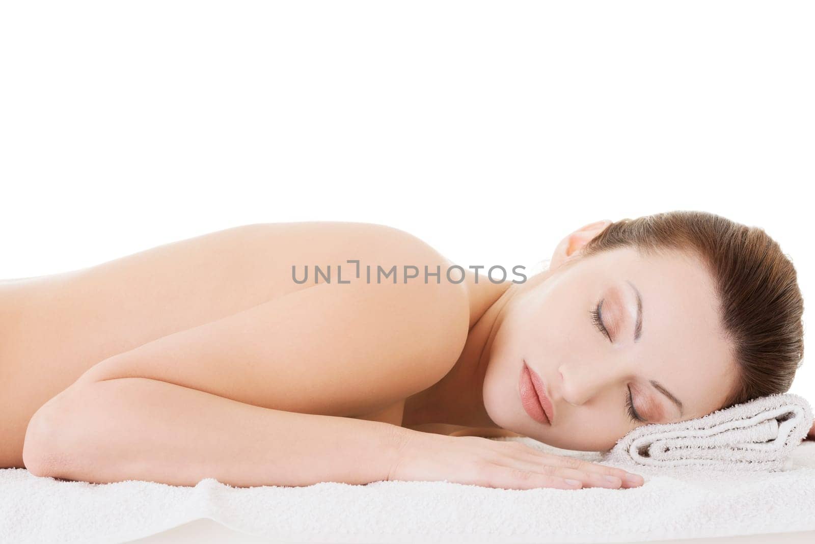 Beauty woman relaxing in spa. Isolated on white.
