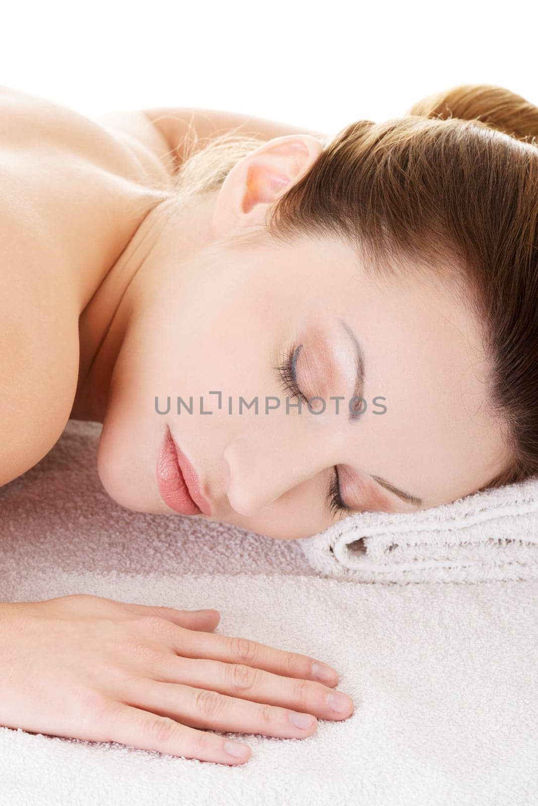 Beauty woman relaxing in spa. Isolated on white.