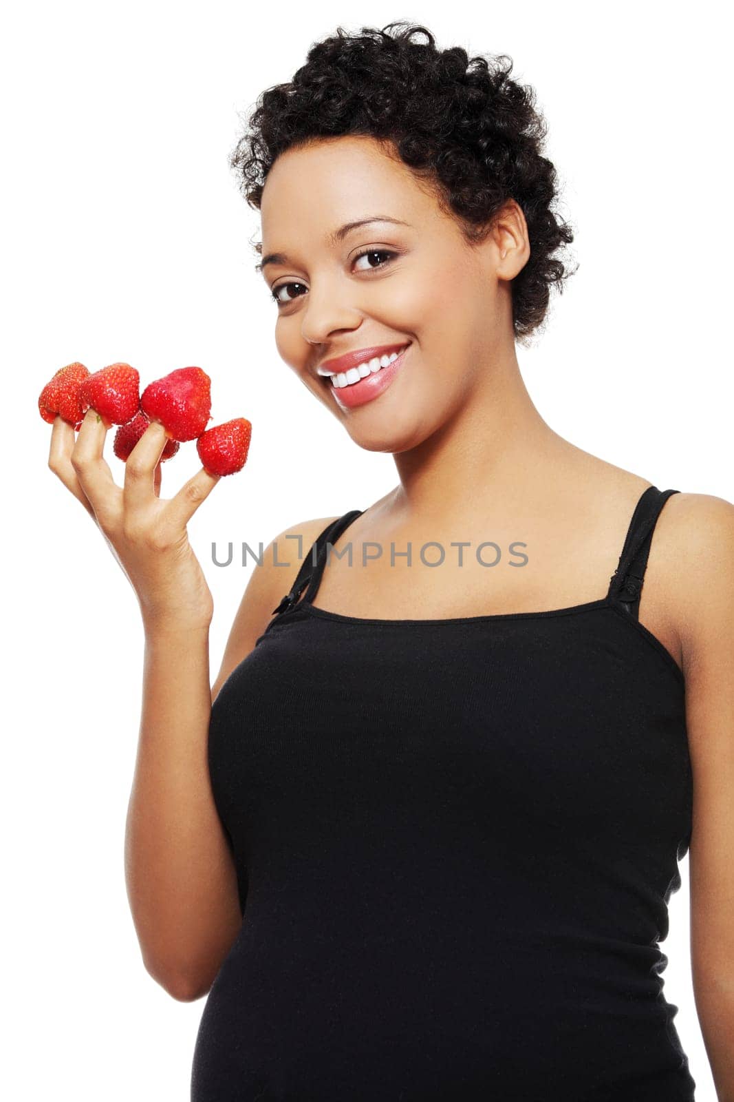 Young happy pregnant afro american woman with strawberries, isolated on white background