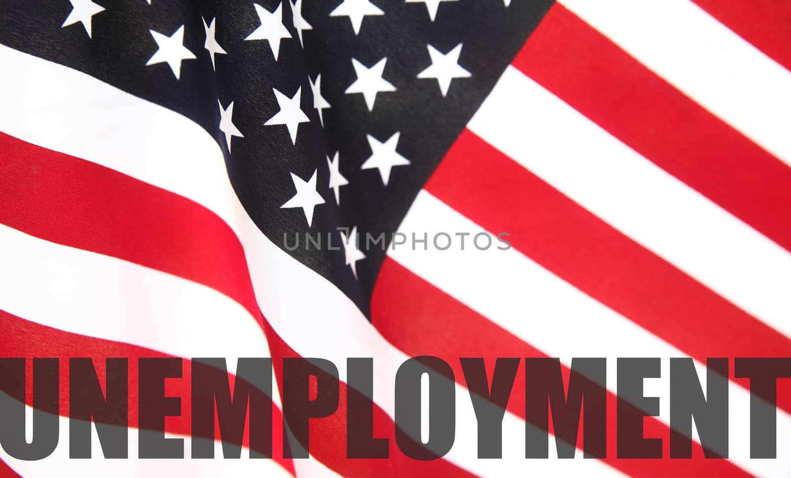 the word 'unemployment' on a USA flag