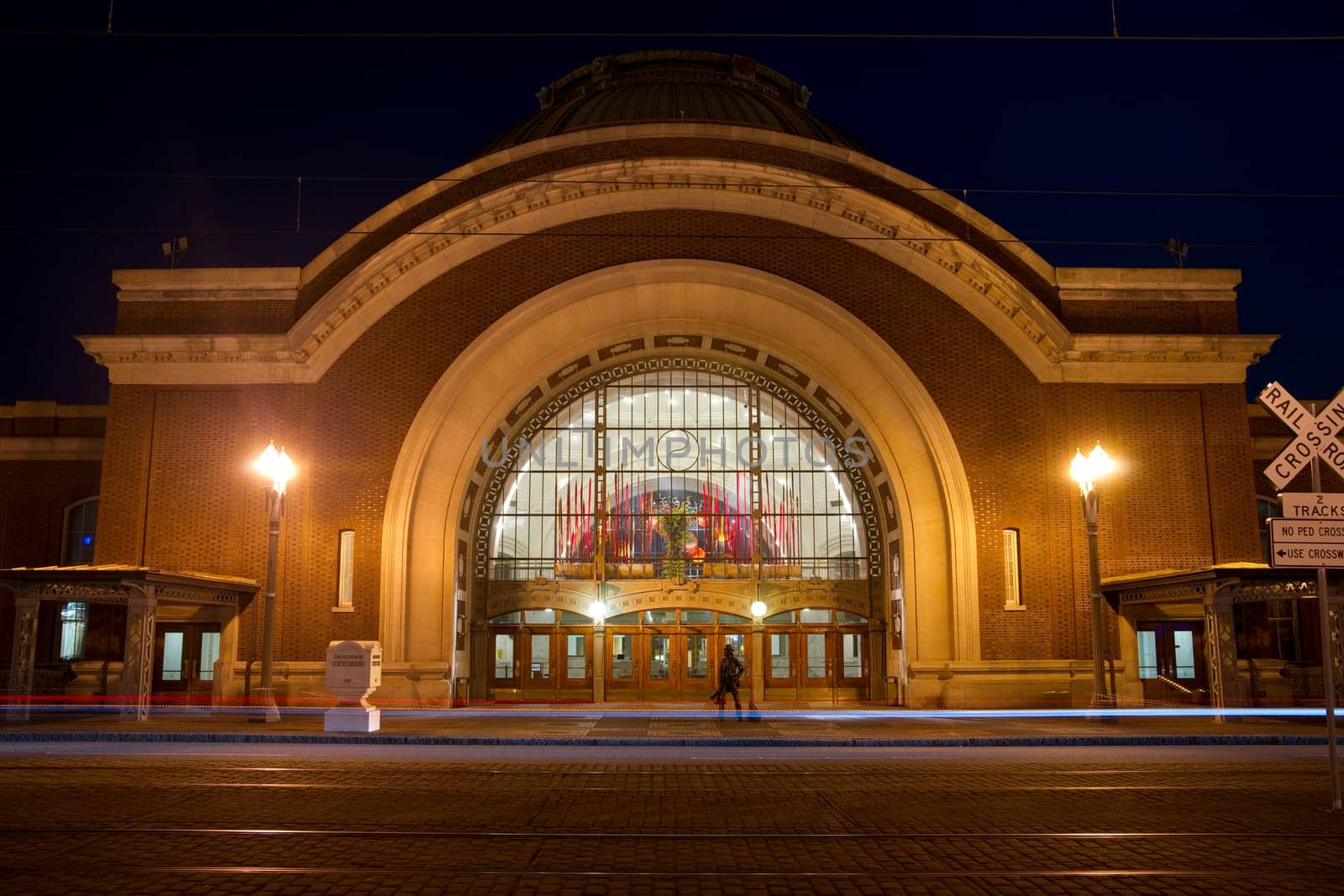Car pass on Pacific Avenue in front of the Old Union Station