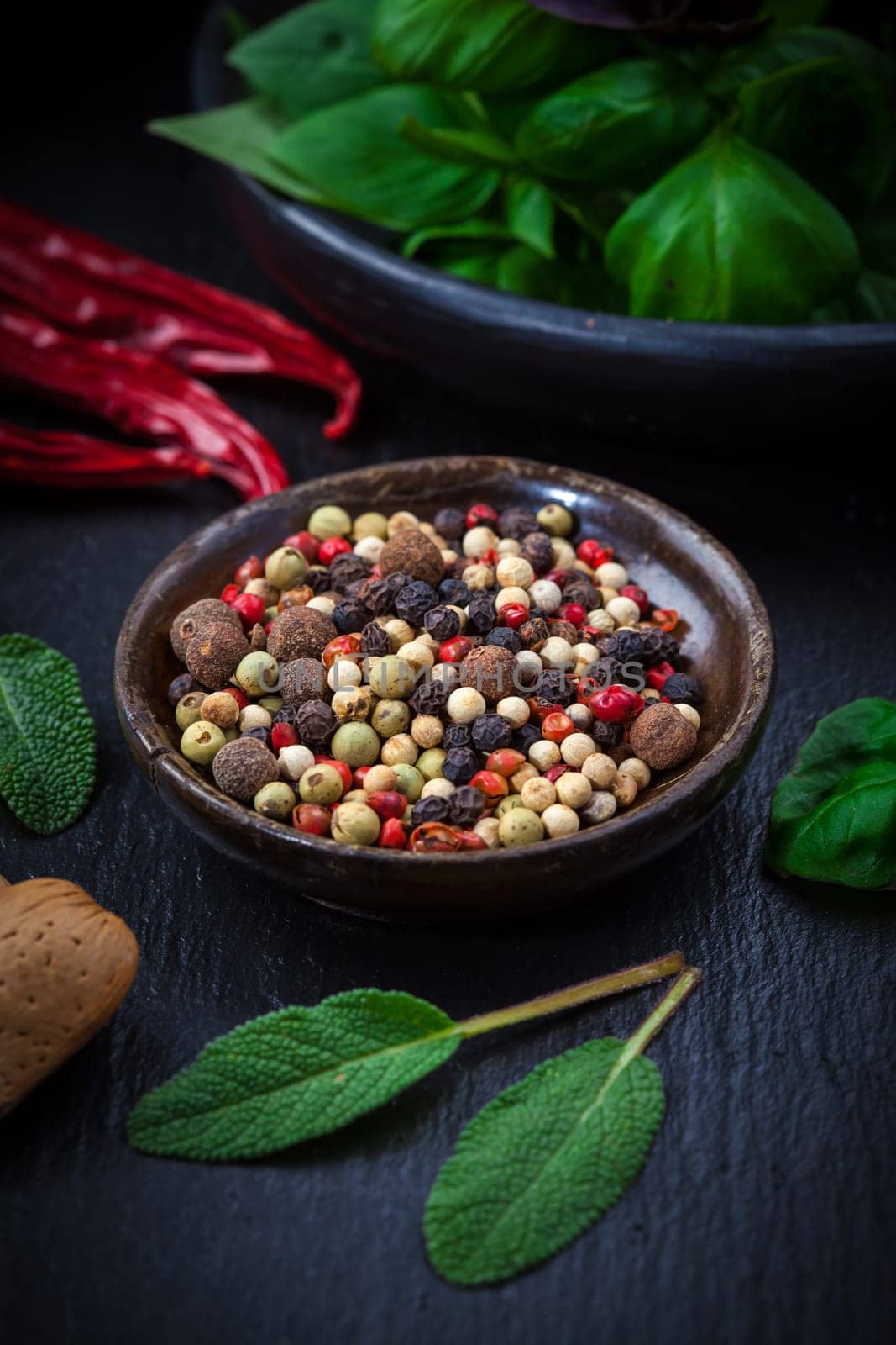 Herbs and spices on black background