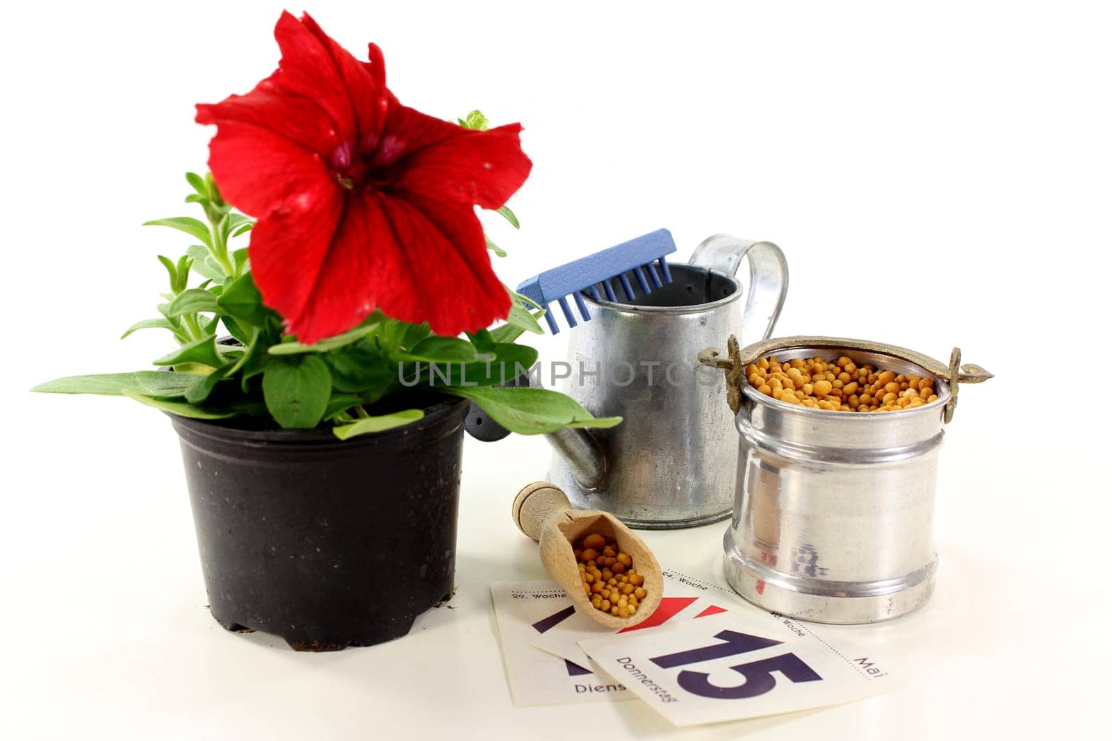 a bucket of slow-release fertilizer against a white background