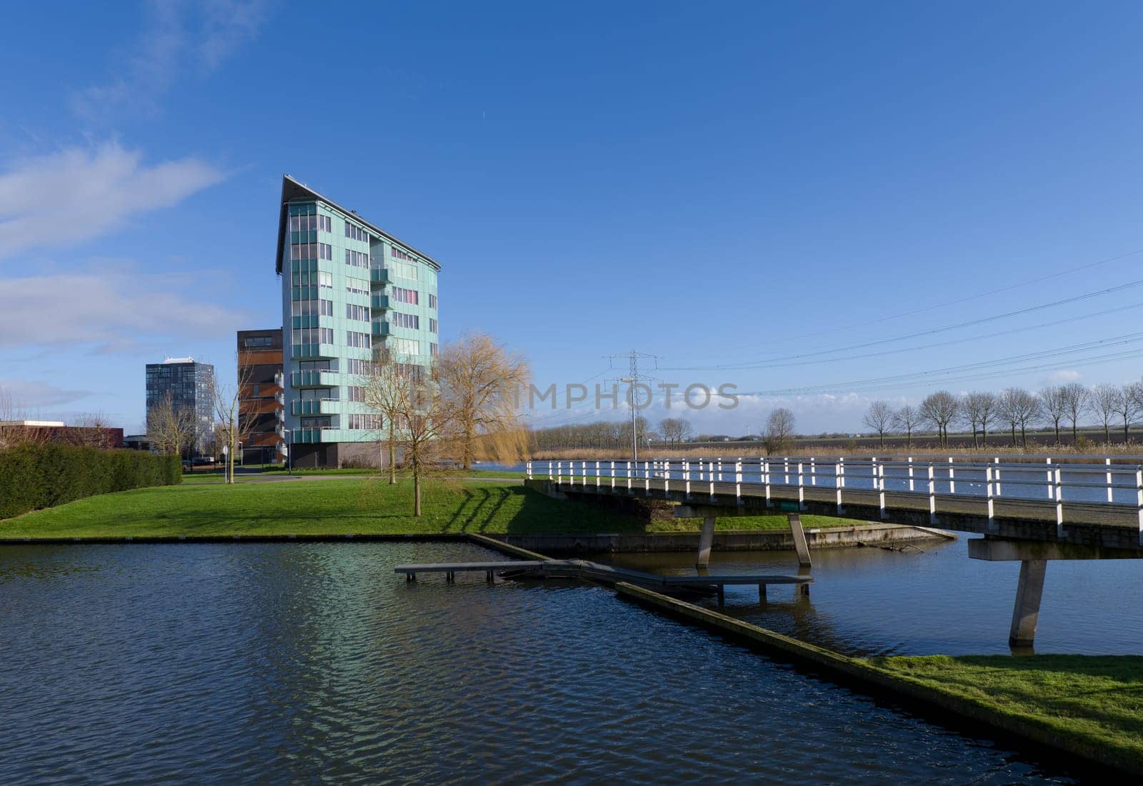modern apartments along a canal in Almere, netherlands