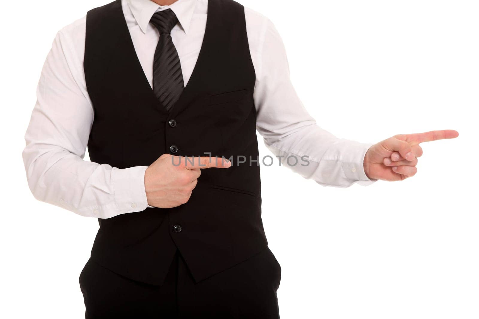 The photo shows an upper body of a man pointing his index fingers to the side.