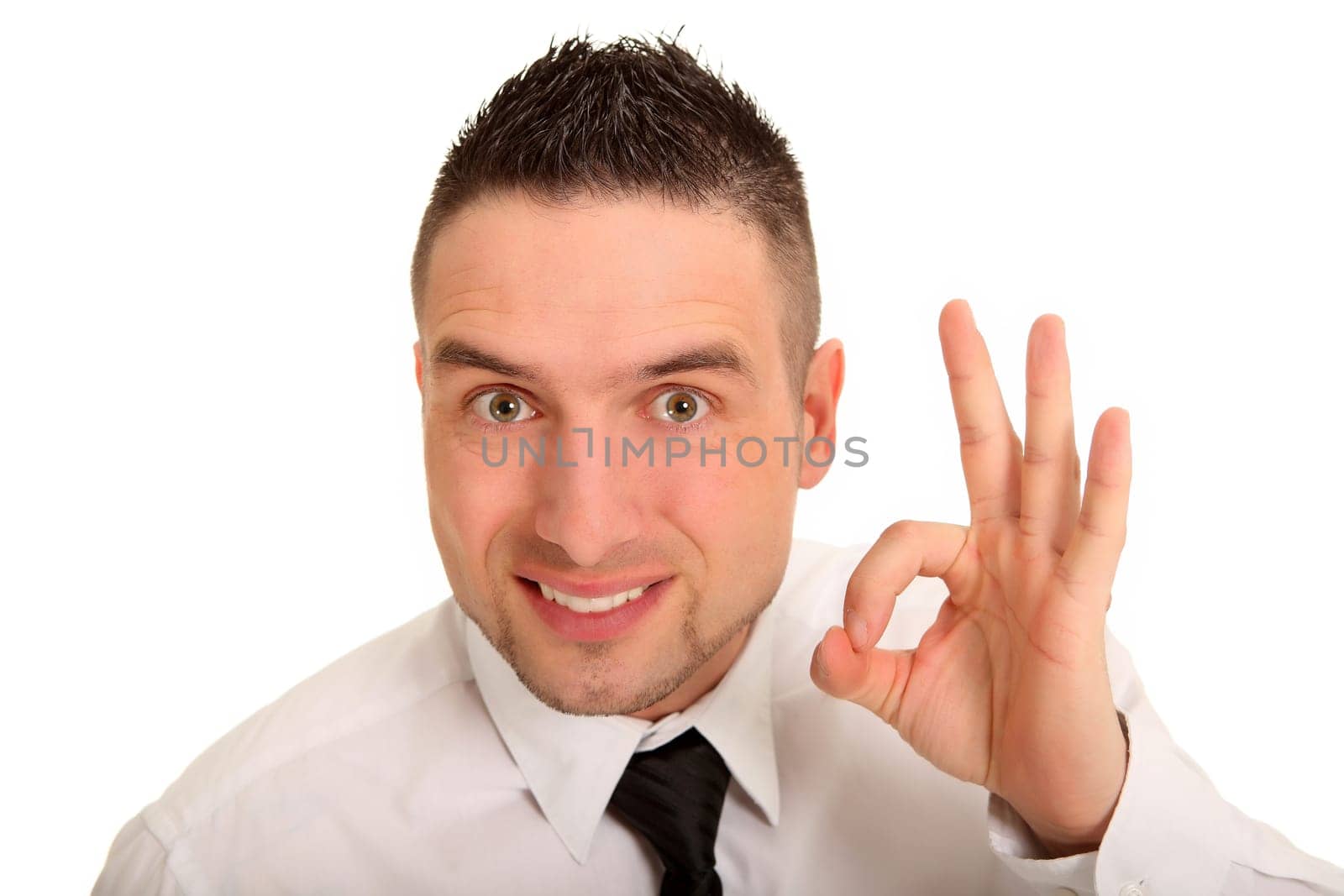 Portrait photo of a young man using his fingers to make the symbol for perfect
