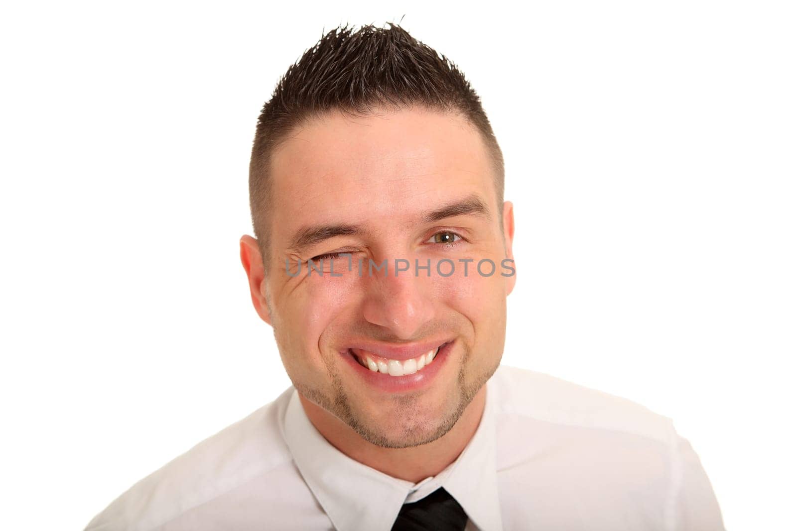 Portrait photo of a young man looking at the camera with a wink