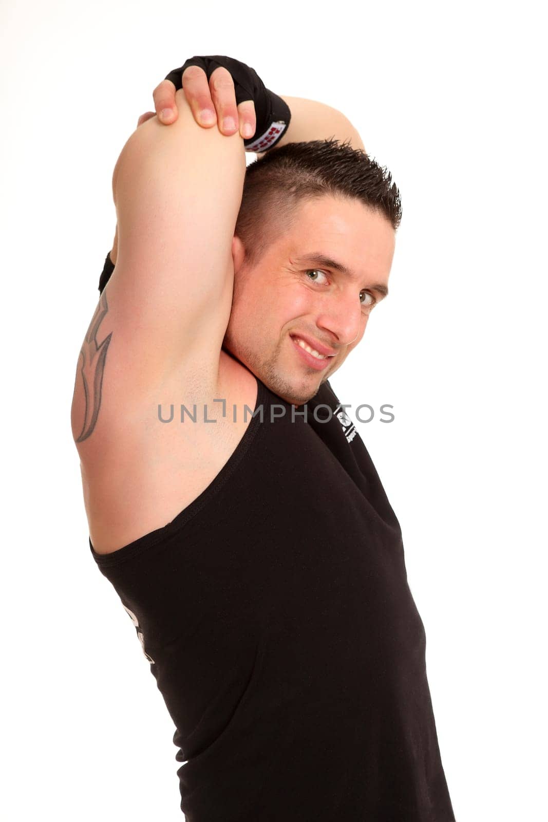 The photo shows a young athlete stretching while smiling into the cameo.