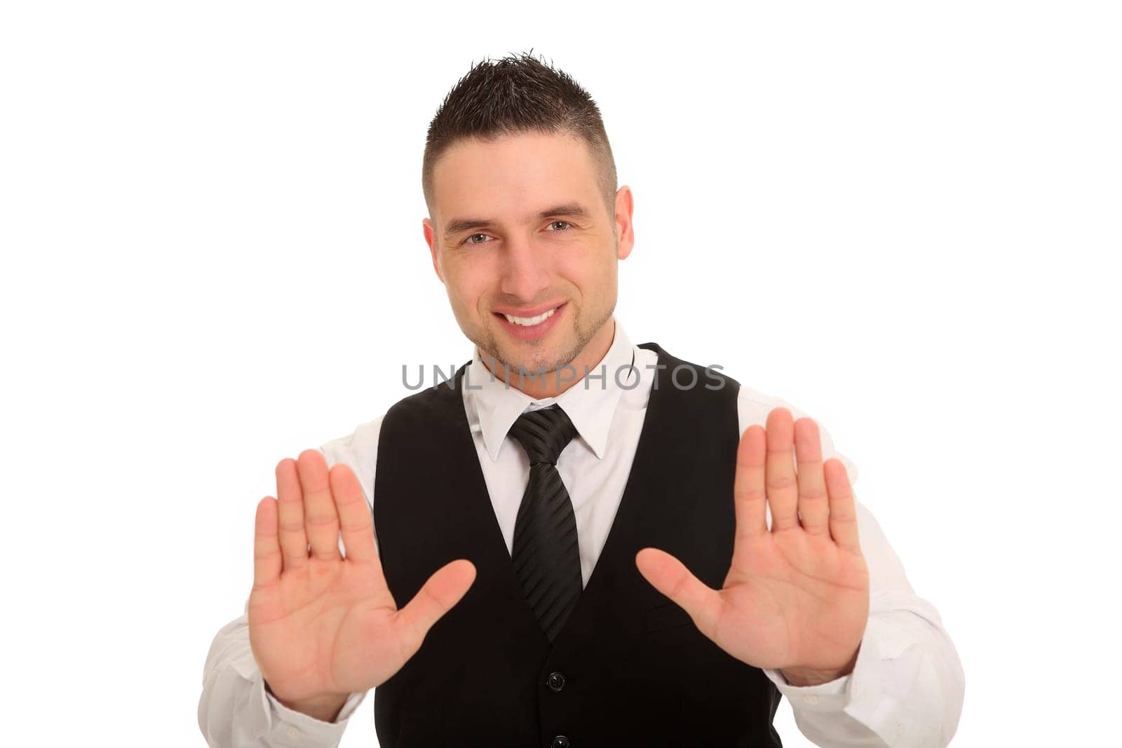 A young man holds both hands forward in a defensive posture and seems to want to stop someone