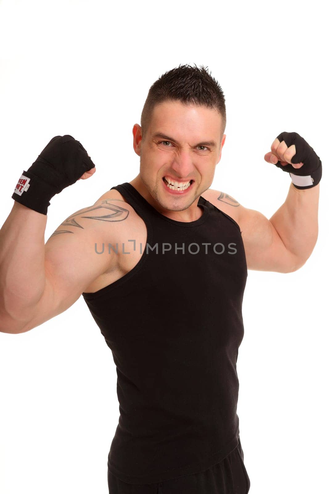 The photo shows a young man powerfully throwing his arms up and pretending to be a winner.