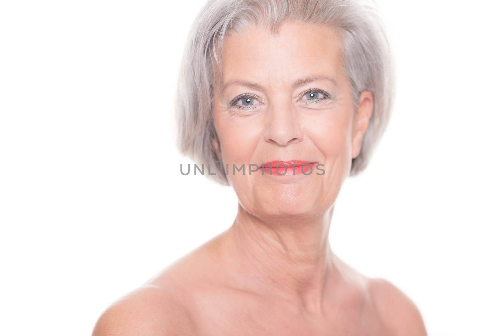 Studio shot of an elderly woman against a white background