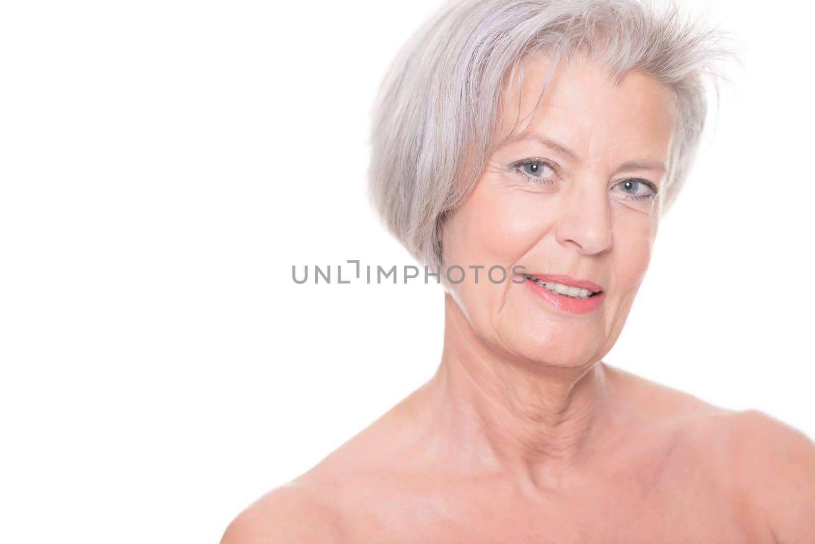 Studio shot of an elderly woman against a white background