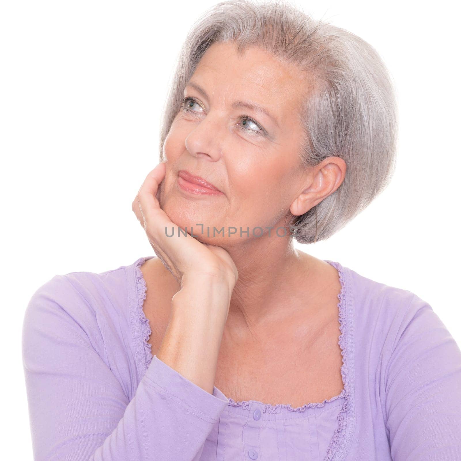 Studio shot of a thoughtful senior woman