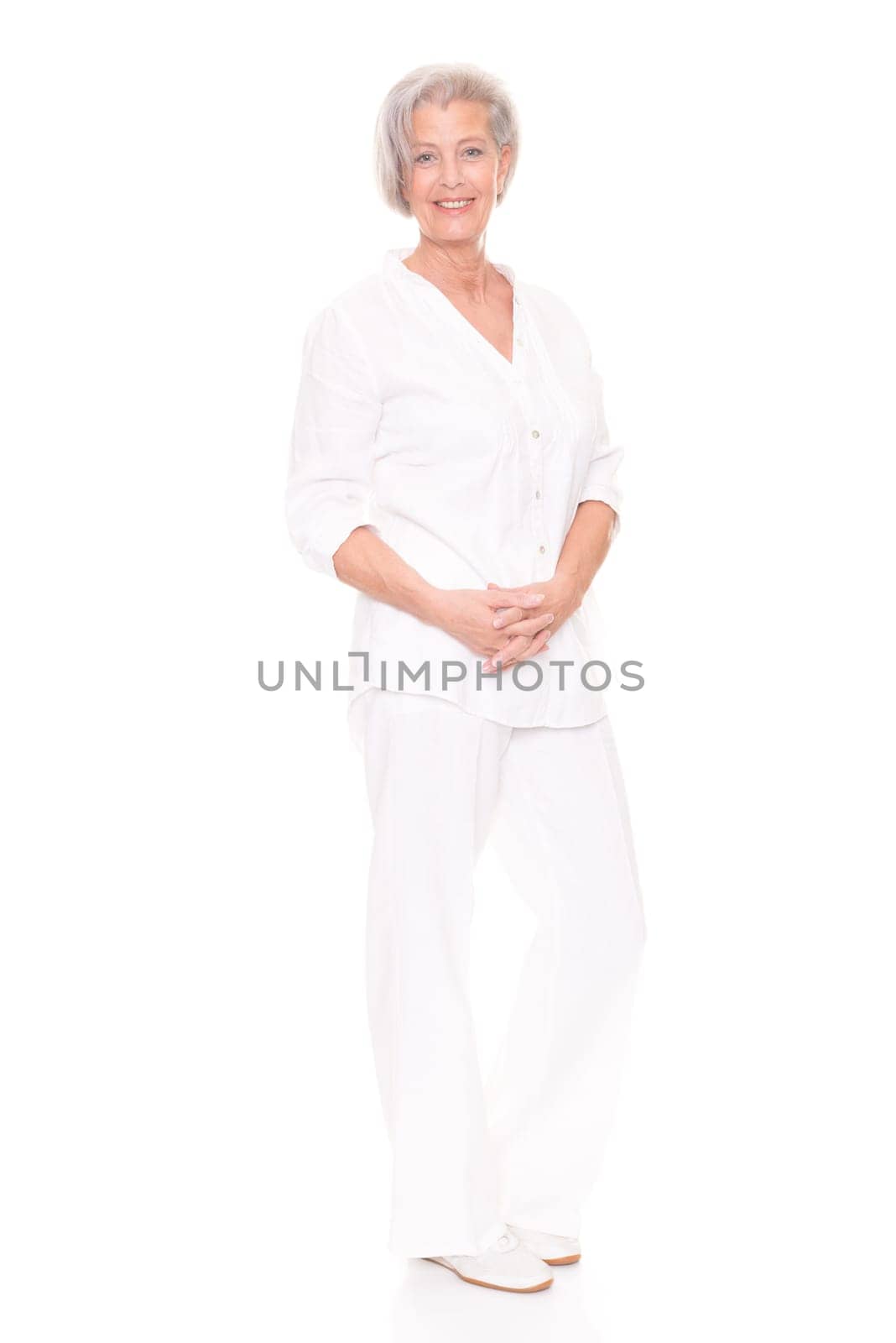 Full length shot of an elderly woman against a white background