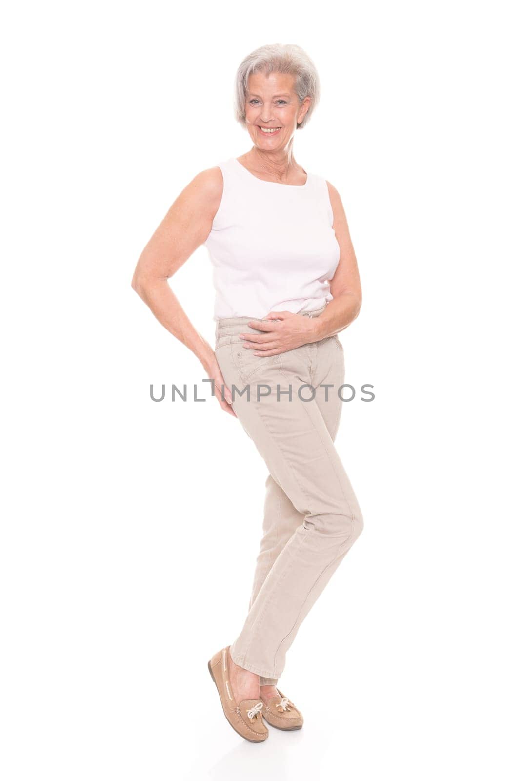 Full length shot of an elderly woman against a white background