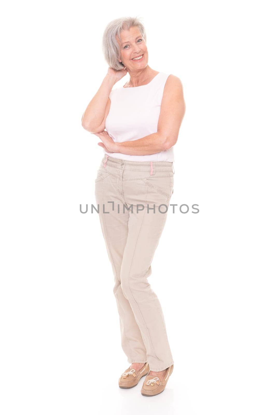 Full length shot of an elderly woman against a white background