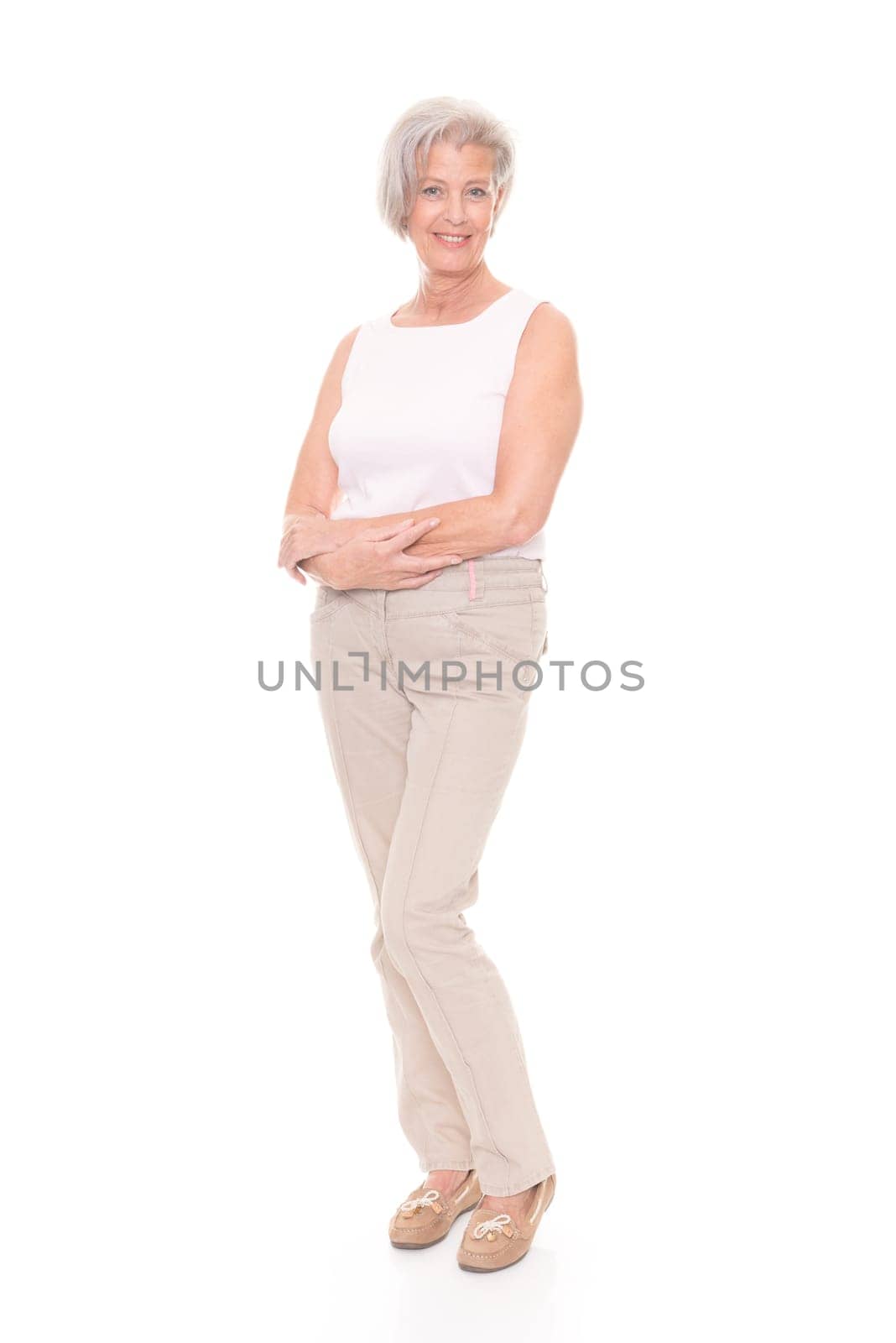 Full length shot of an elderly woman against a white background