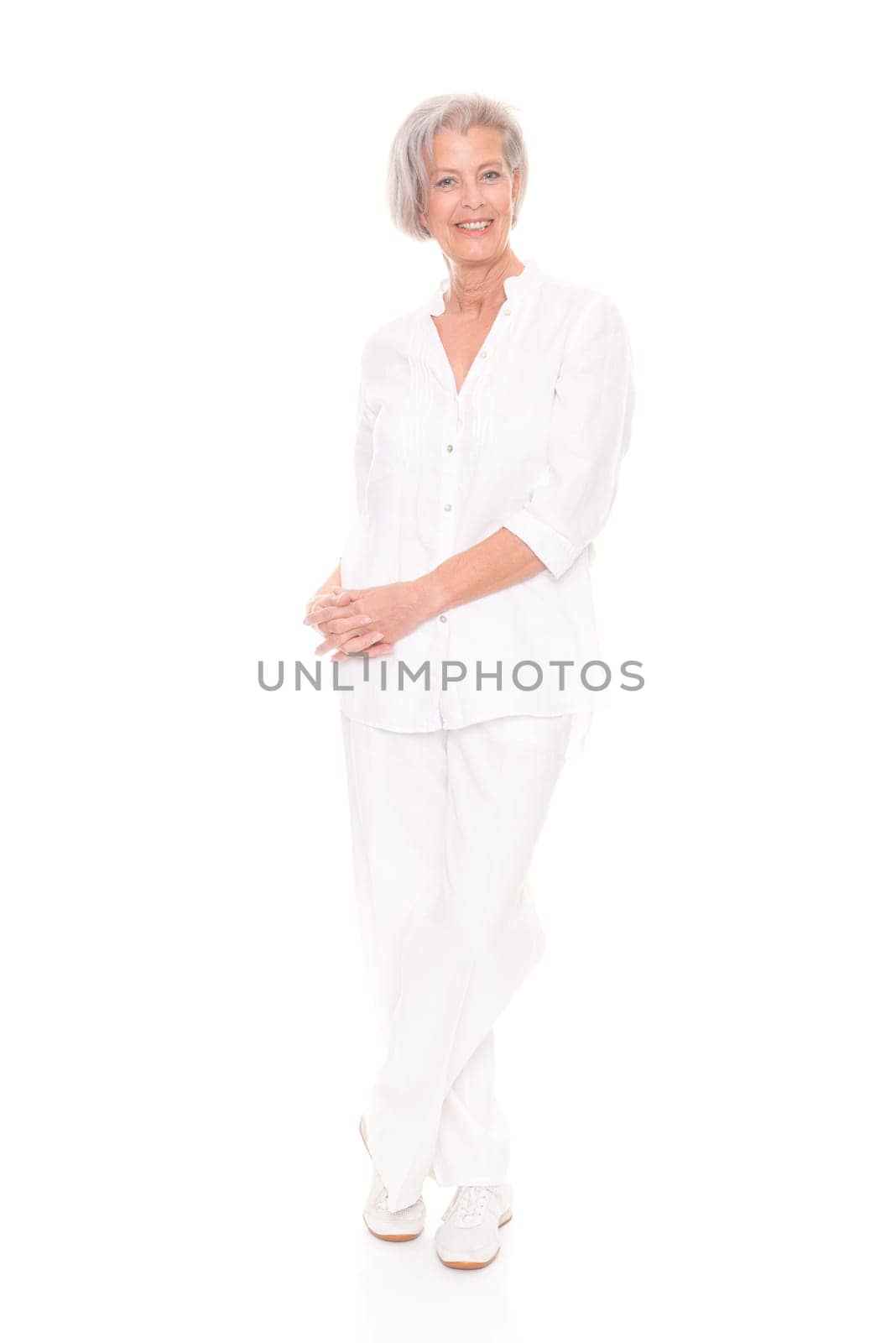Full length shot of an elderly woman against a white background