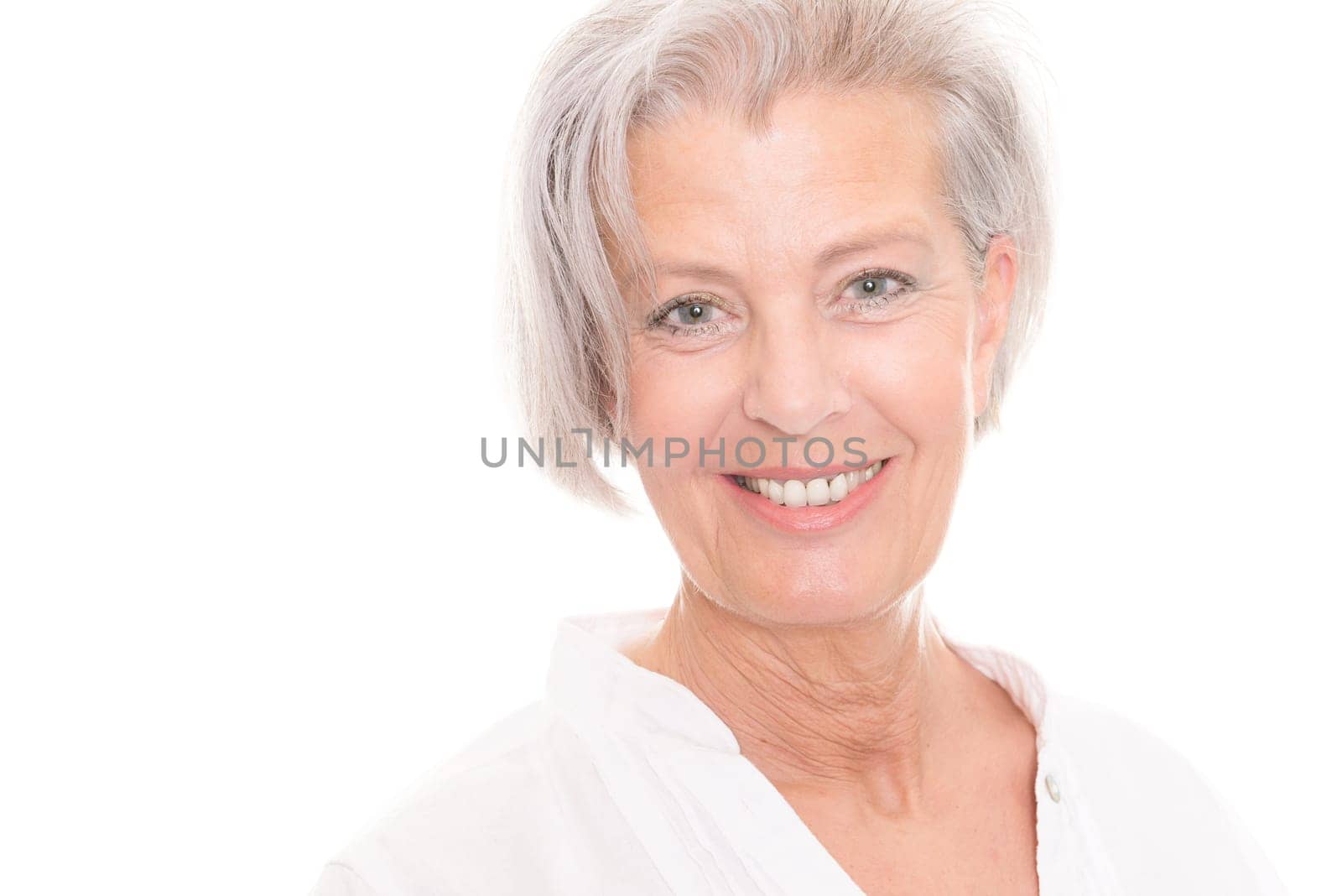 Portrait of an elderly woman against a white background