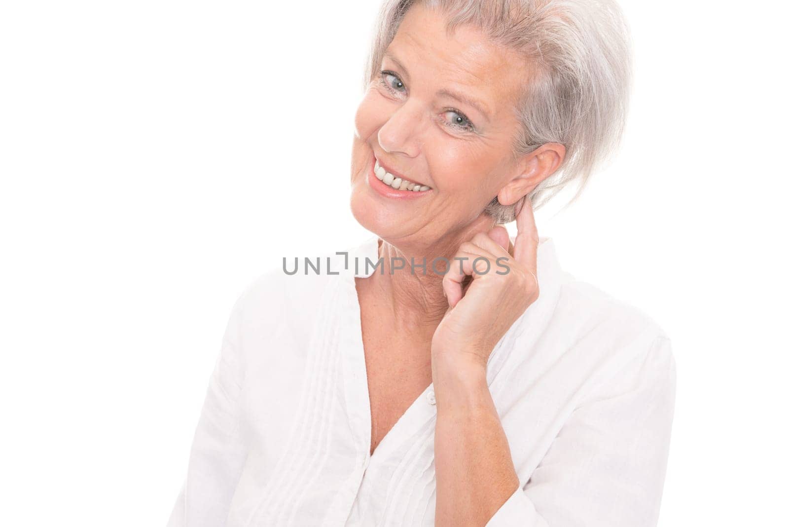 Portrait of an elderly woman against a white background