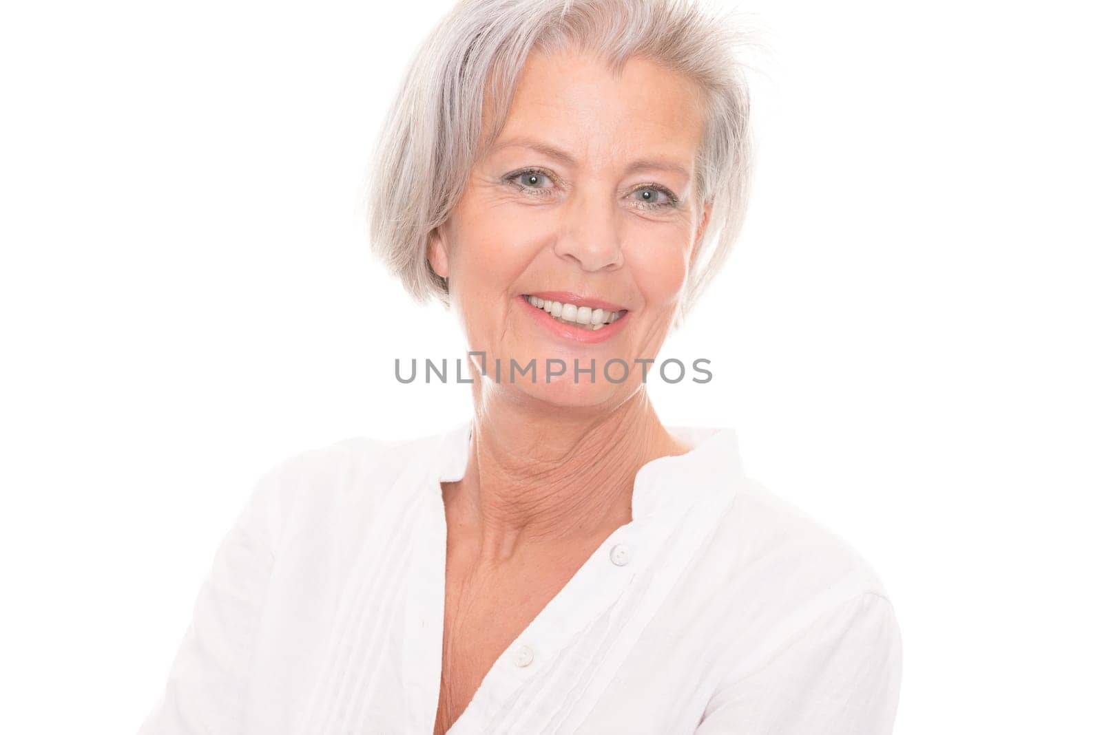 Portrait of an elderly woman against a white background