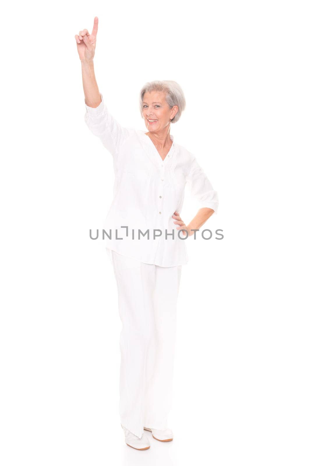 Full length shot of an elderly woman against a white background