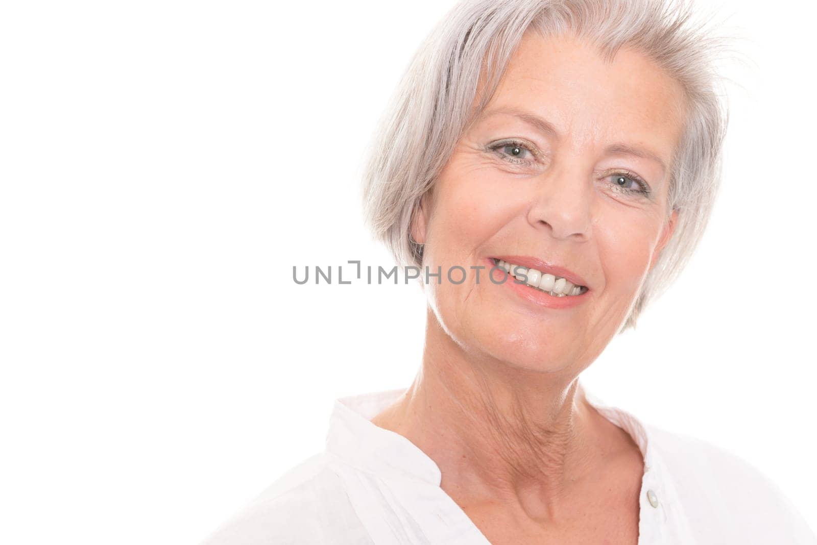 Portrait of an elderly woman against a white background