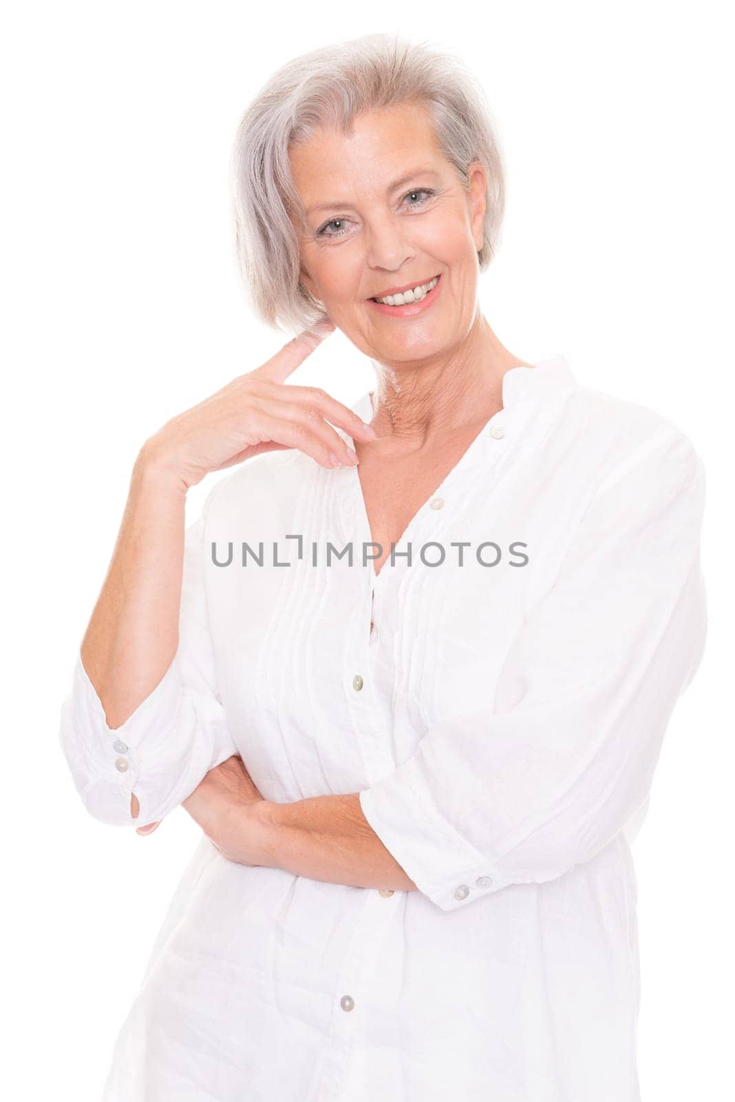 Portrait of an elderly woman against a white background