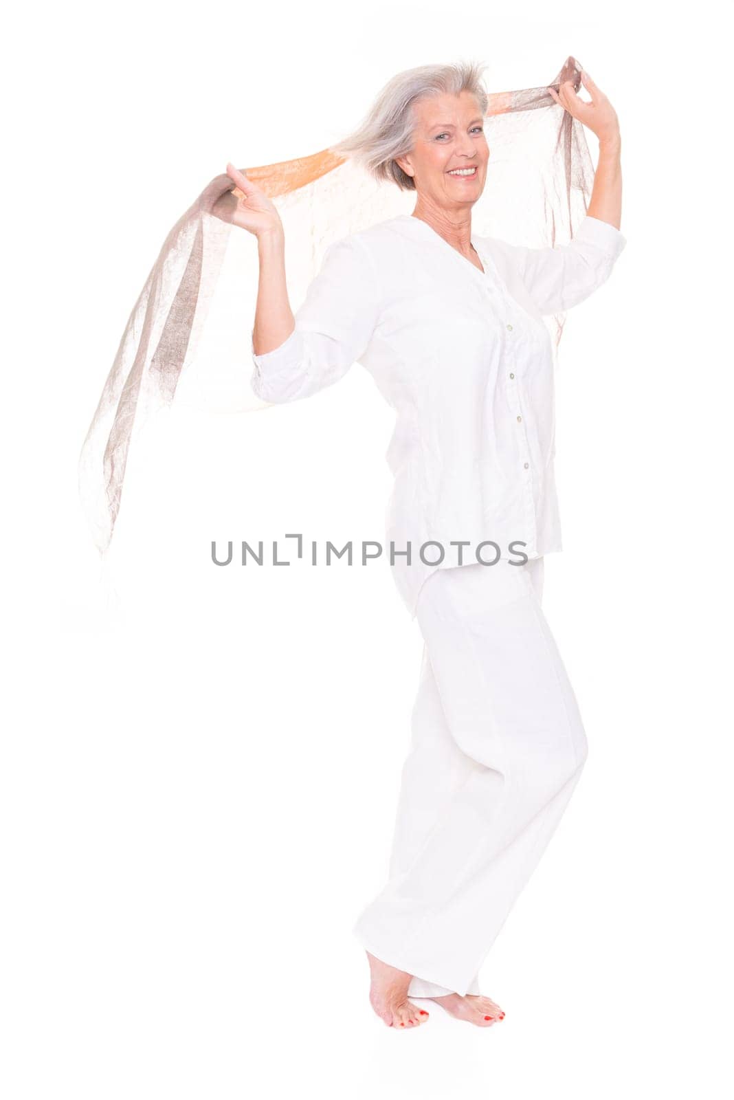 Happy senior woman with a cloth against a white background