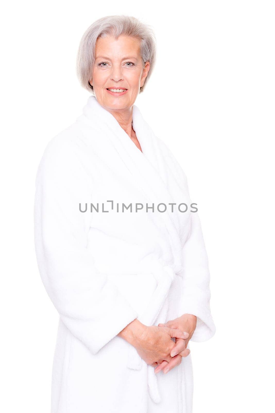 Studio shot of an elderly woman in a white bathrobe