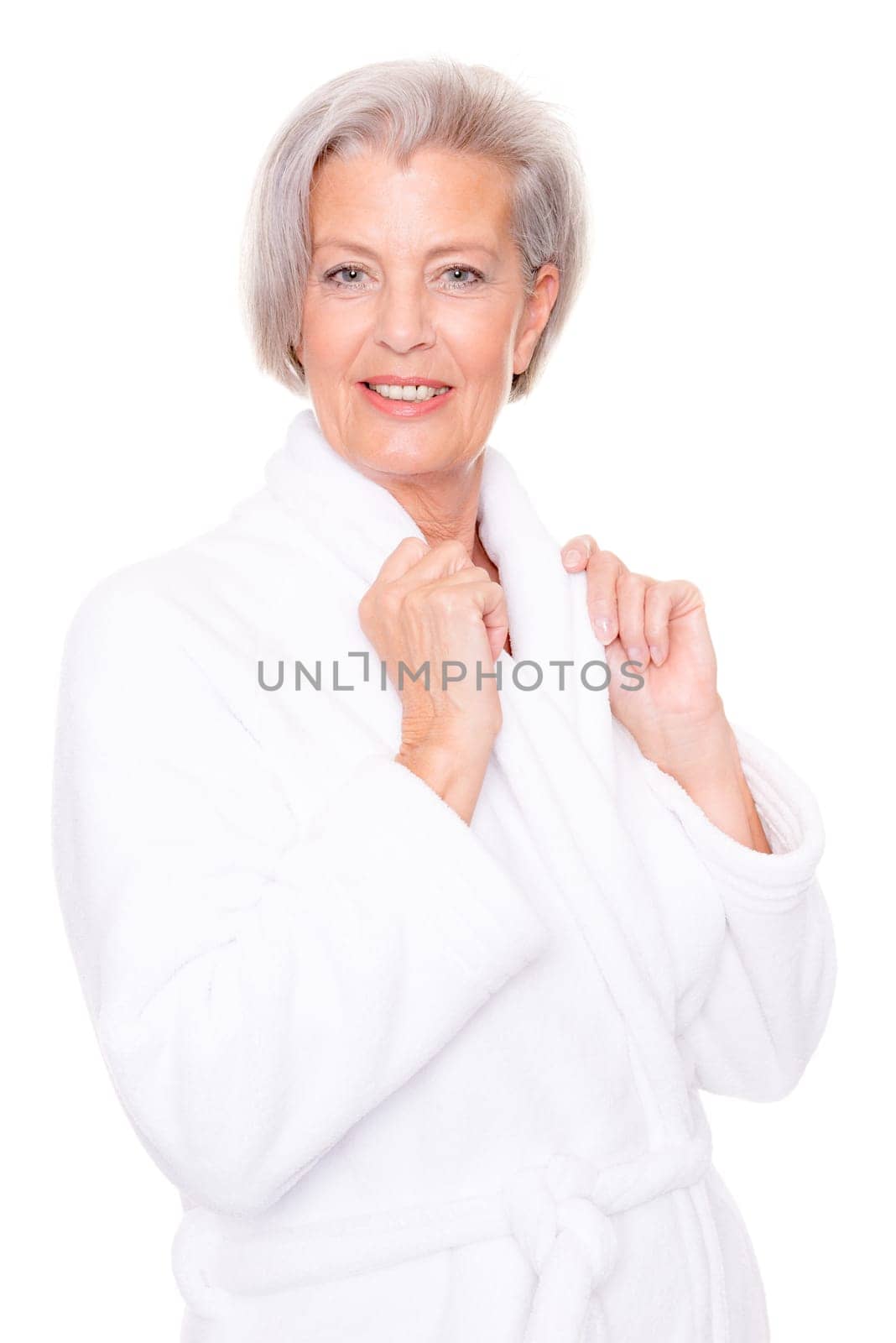 Studio shot of an elderly woman in a white bathrobe