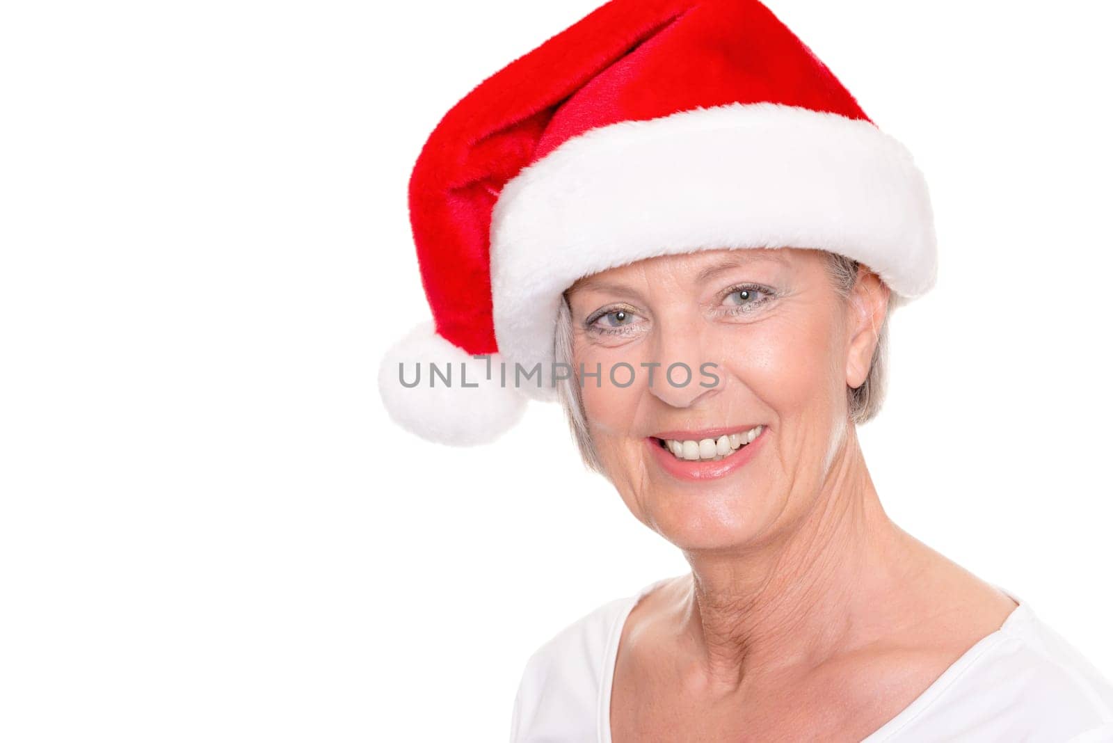 Senior woman with a Santa hat against a white background