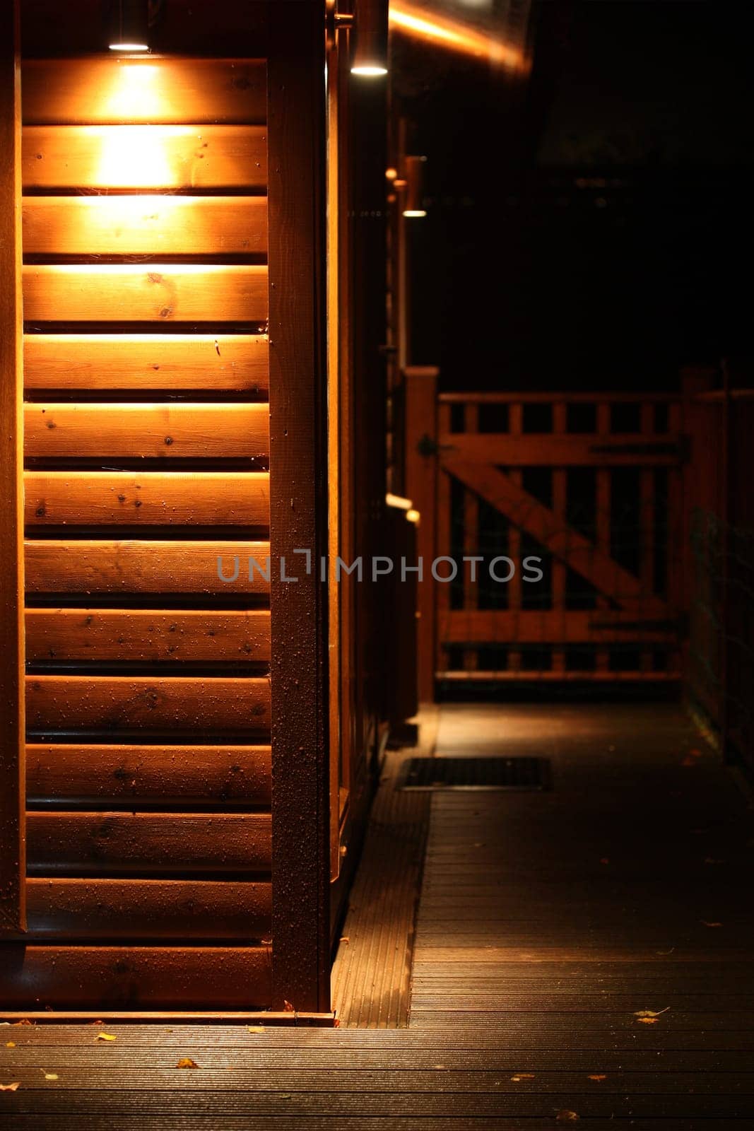 Spot light lodge at night with space for sign