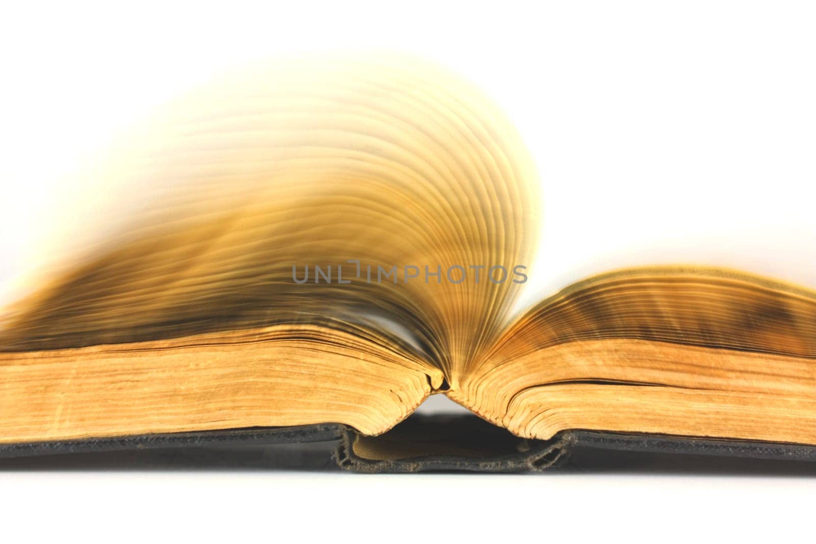 Old book flipping on a white background
