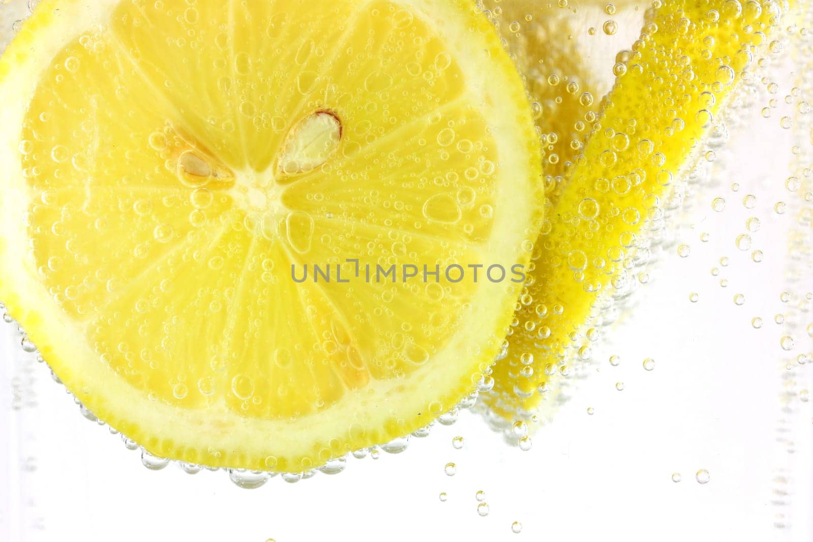 Sliced lemon in refreshing fizzy water