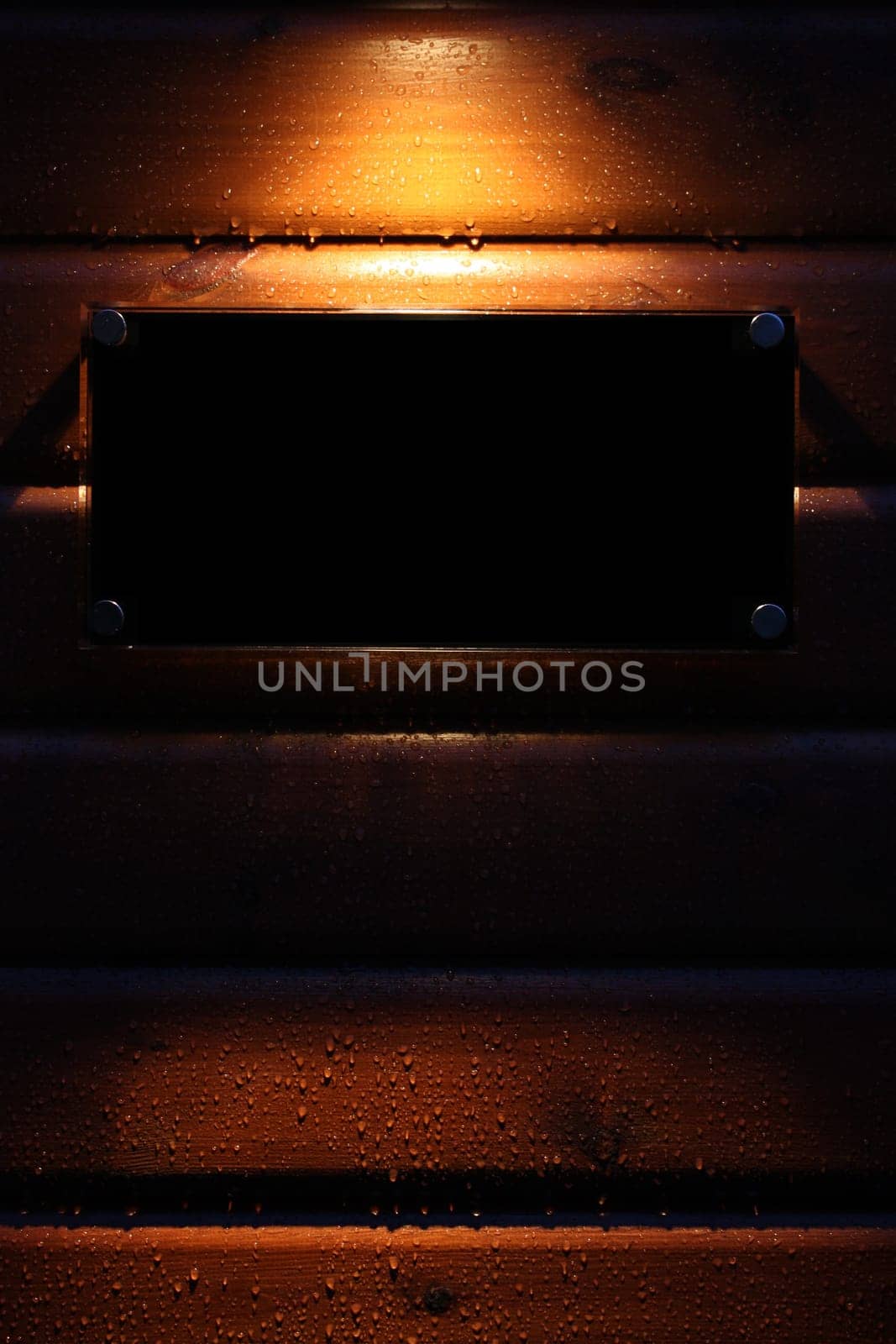 Spotlight on a black empty sign