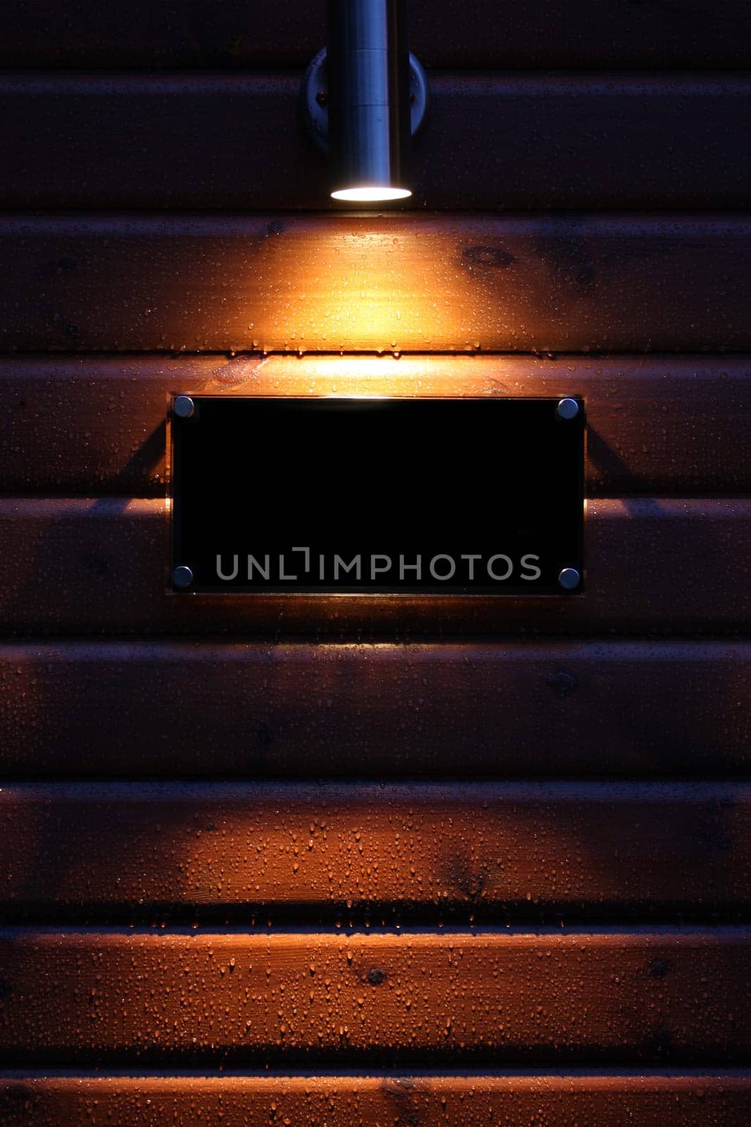 Spotlight on a black empty sign