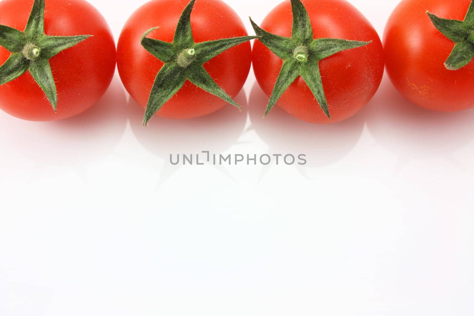 Vine tomatoes on top edge with copy space