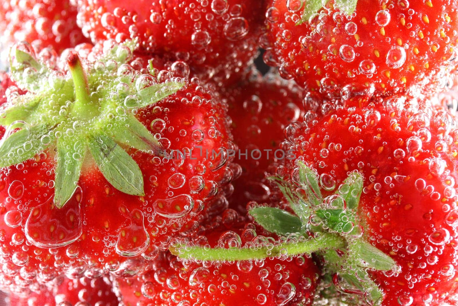 Strawberries in water close up