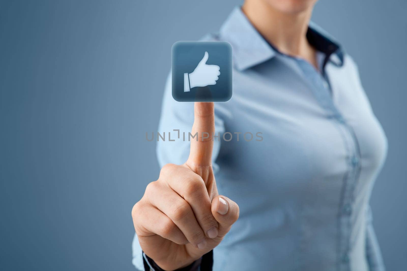 Social network concept. Young woman click on the like button.