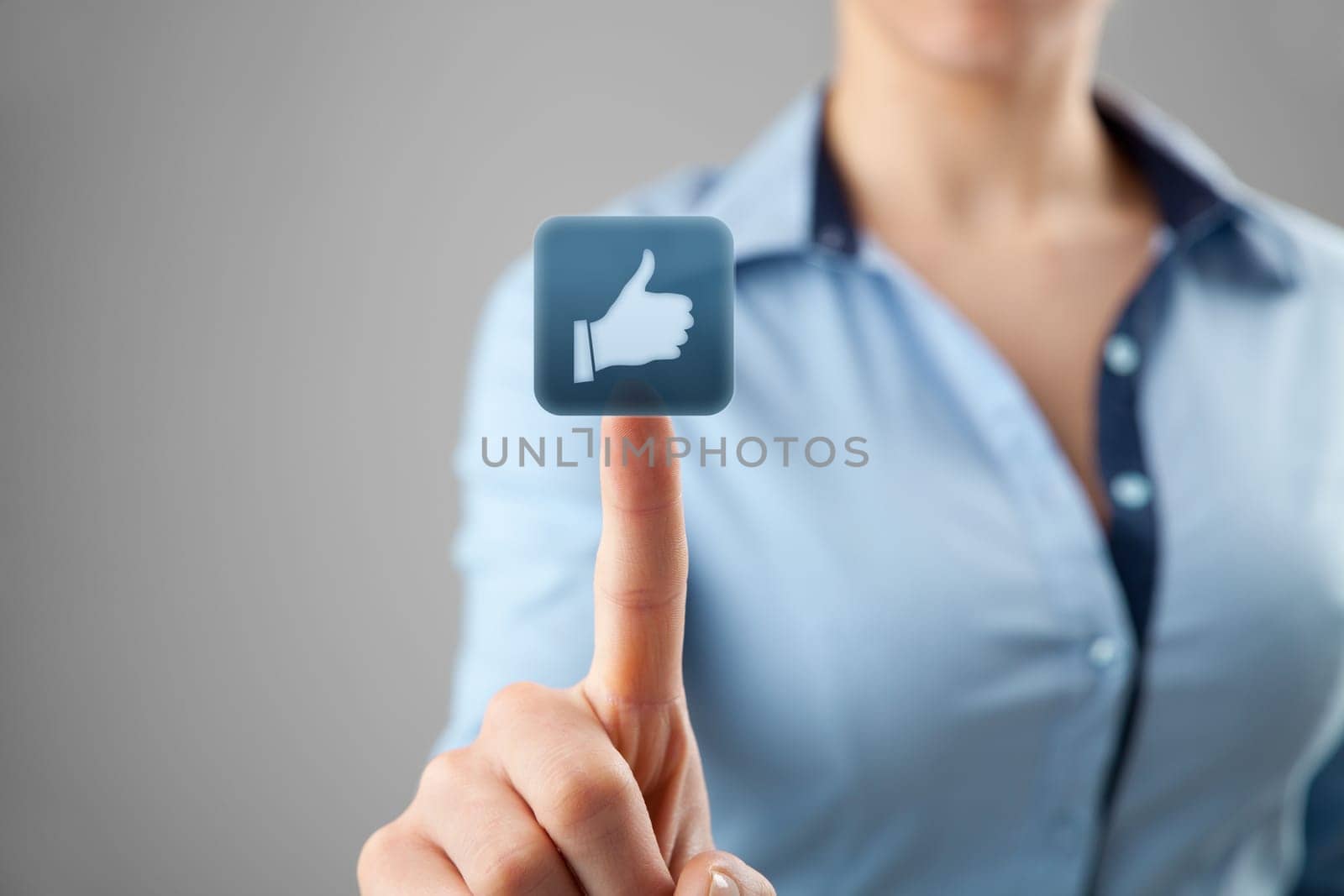 Social media concept. Young woman click on the like button.