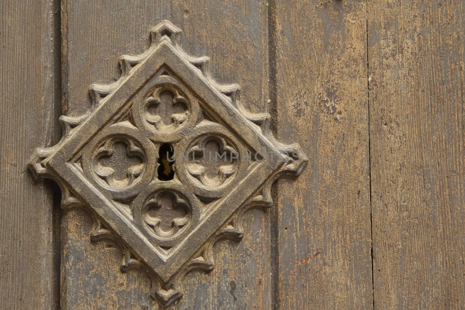Old metal medieval door background. With a key lock on the left side